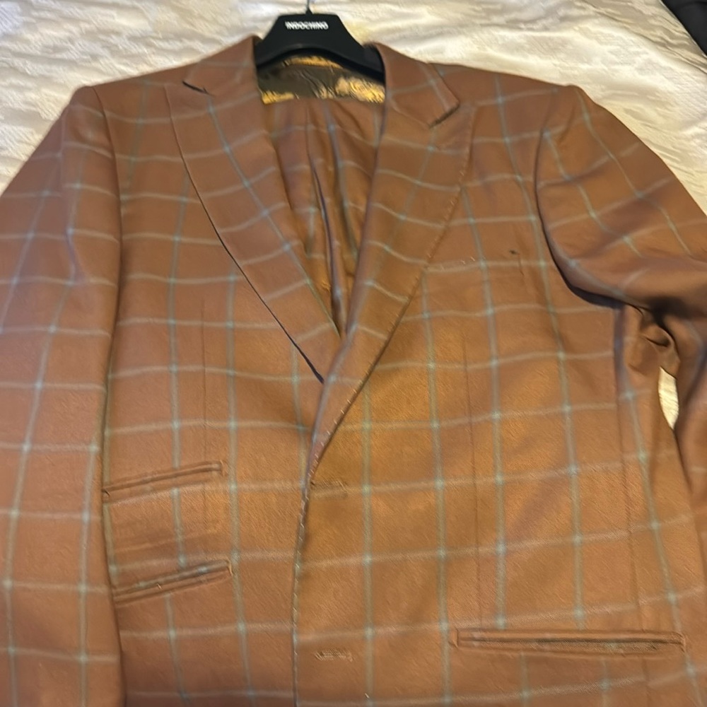 Light brown and turquoise box suit